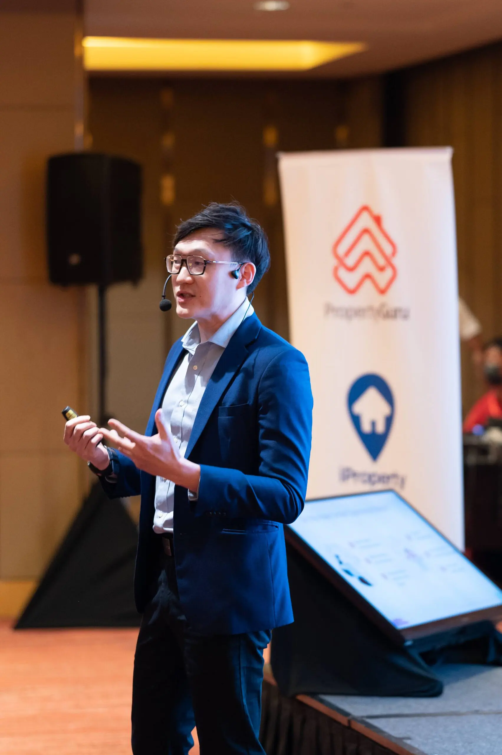 Alexander Ang speaking at an industry event